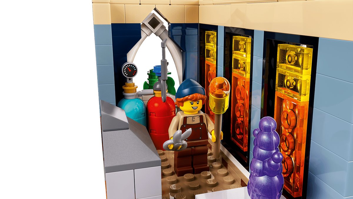 The glassblower minifigure in the workshop with gas bottles and a glowing furnace